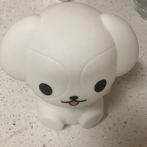 A bear that light white and different color for the night .